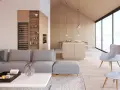 Jasny, przestronny salon z aneksem kuchennym w stylu skandynawskim. Drewniane wykończenia, duża sofa i kominek tworzą przytulną atmosferę.