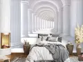 Sypialnia z fotorealistyczną tapetą przedstawiającą antyczny korytarz z kolumnami.
