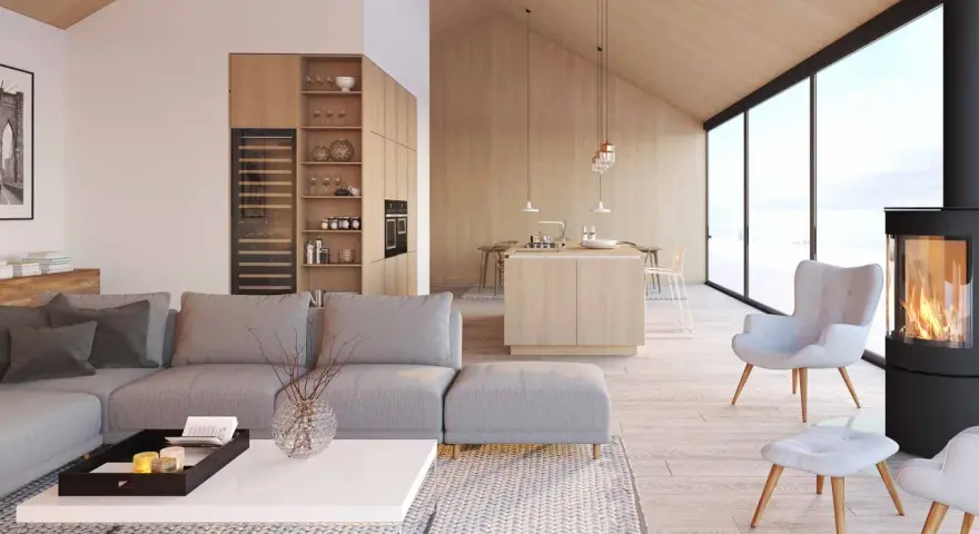 Jasny, przestronny salon z aneksem kuchennym w stylu skandynawskim. Drewniane wykończenia, duża sofa i kominek tworzą przytulną atmosferę.