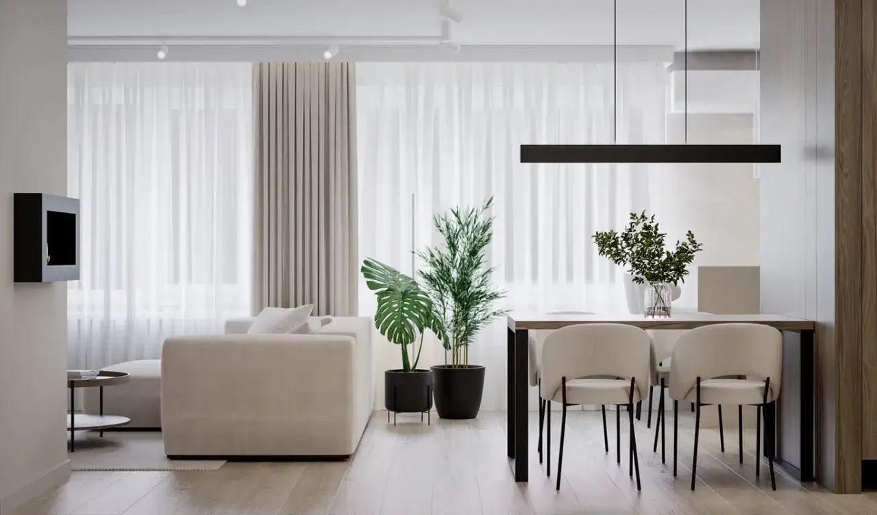 Miękka sofa i krzesła w kolorze kaszmirowym tworzą przytulną atmosferę w nowoczesnym salonie z jadalnią.
